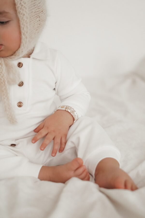 Organic baby polo bodysuit – hypoallergenic and sustainable, available in our Swiss baby shop